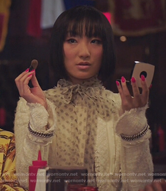 Mei's white chain detail jacket on Sunnyside