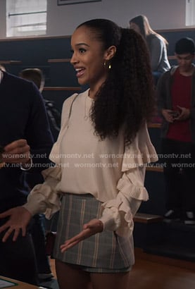 Magnolia's white ruffle sweater and plaid skirt on Insatiable