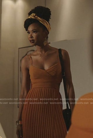 Monica's orange pleated dress on Dynasty
