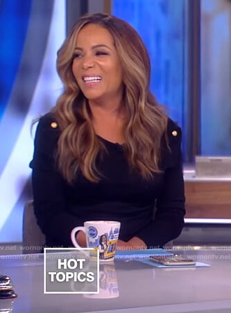 Sunny's black shoulder button sweater and zebra striped skirt on The View