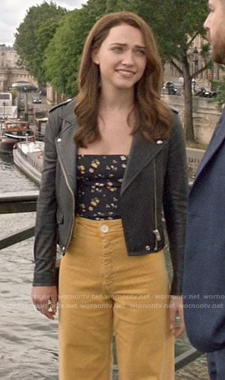 Cara's black floral tie strap top  with yellow jeans and leather jacket on God Friended Me