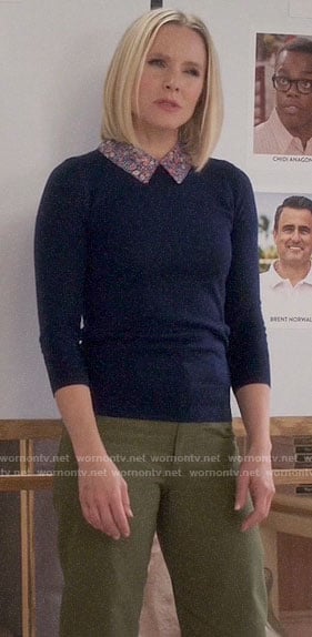 Eleanor's navy blue sweater with floral collar on The Good Place