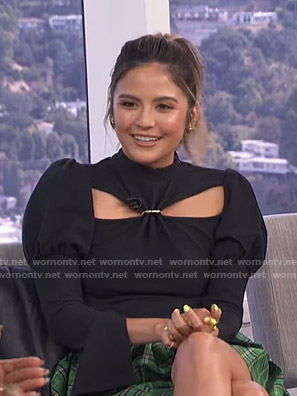 Erin's black cutout top and green plaid mini skirt on E! News