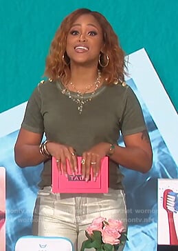 Eve's green button shoulder tee on The Talk