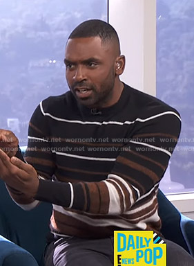 Justin's black striped sweater on E! News Daily Pop