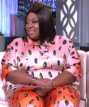 Loni's pink and orange printed jumpsuit on The Real