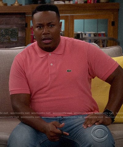Marty's coral pink polo shirt on The Neighborhood