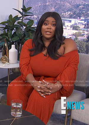Nina's orange ribbed jumpsuit on E! News