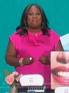 Sheryl's pink satin top on The Talk