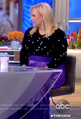 Meghan's black star sweater and purple skirt on The View