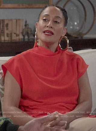 Rainbow's red draped top and side stripe pants on Black-ish