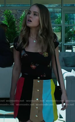 Patty's black floral top and stripe skirt on Insatiable