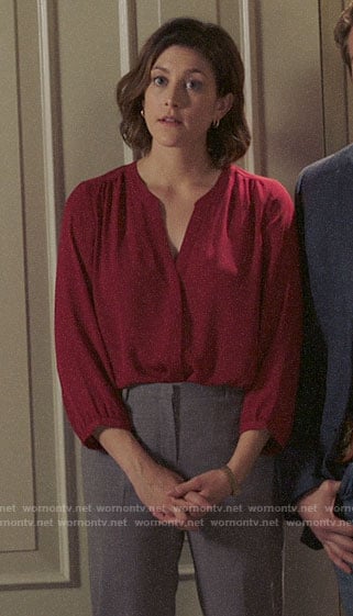 Sydney's red split neck blouse on Bluff City Law