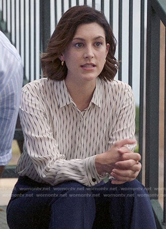 Sydney's white link print blouse on Bluff City Law