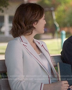 Sydney's white blazer with red striped trim on Bluff City Law