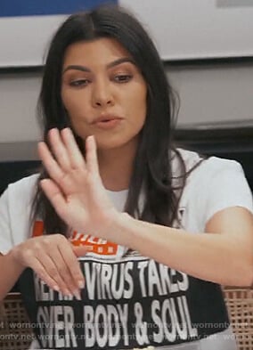 Kourtney's white newspaper print tee on Keeping Up with the Kardashians
