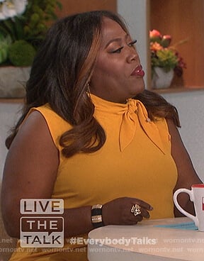 Sheryl's yellow sleeveless tie neck top on The Talk