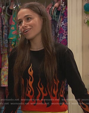 Tess's black flame print sweater on Ravens Home