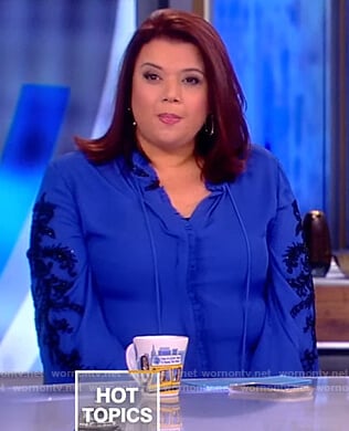 Ana's blue embellished tie neck blouse on The View