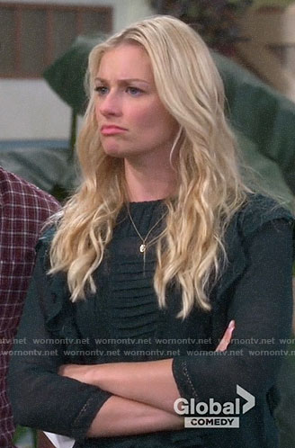 Gemma's green ruffled top on The Neighborhood