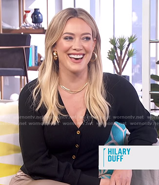 Hilary Duff's black cardigan and wide leg pants on E! News Daily Pop