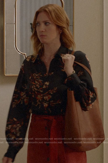 Julia's black floral blouse and red button front skirt on Almost Family