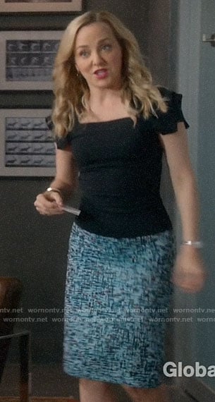 Marissa's black square neck top and blue printed skirt on Bull