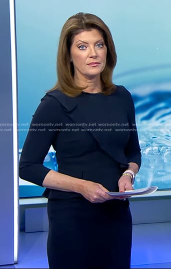 Norah's navy ruffle trim dress on CBS Evening News