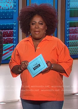 Sheryl's orange v-neck shirt on The Talk