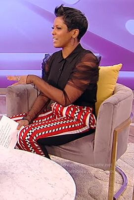 Tamron's black sheer sleeve blouse and pants on Tamron Hall Show