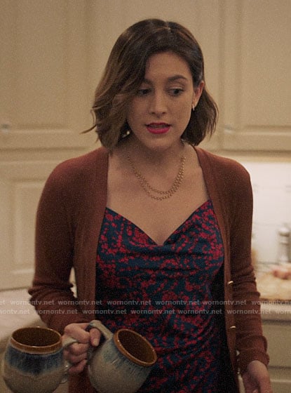 Sydney's blue and red floral cowl neck dress and tan cardigan on Bluff City Law