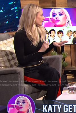 Morgan's black sweater and side striped pants on E! News Nightly Pop
