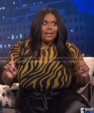 Nina's yellow zebra print top on E! News Nightly Pop