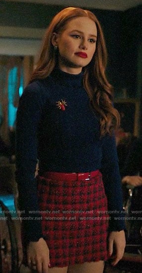 Cheryl's blue turtleneck and red check skirt on Riverdale
