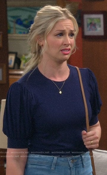 Gemma's navy blue puff sleeve top on The Neighborhood