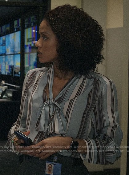 Hannah's blue striped tie neck blouse on The Morning Show