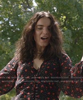 Megan's black heart print lace-up top on Shameless