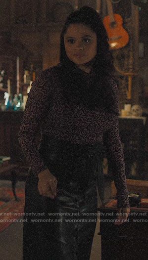 Mel's printed mesh top and leather skirt on Charmed