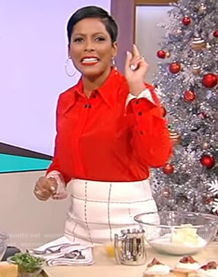 Tamron's red contrast cuff shirt and check skirt on Tamron Hall Show
