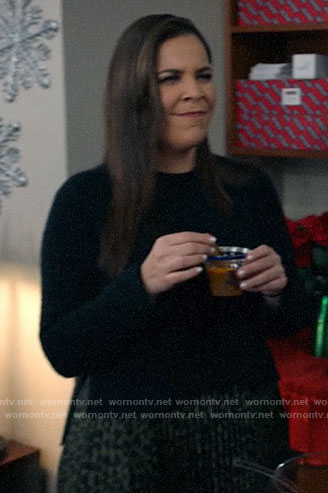 Sara's black sweater and leopard print pleated skirt on All Rise