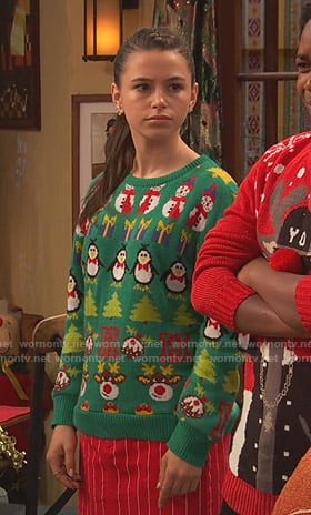 Tess's green ugly christmas sweater on Ravens Home