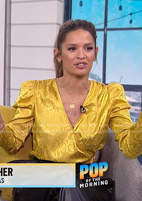 Rocsi Diaz's yellow snake print wrap blouse on E! News