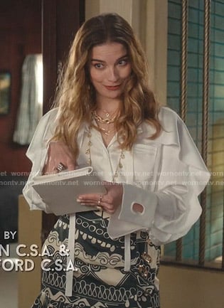 Alexis's white ruffled blouse and print mini skirt on Schitts Creek