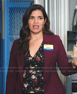 Amy's black floral wrap top on Superstore
