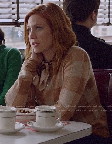 Julia's beige buffalo check sweater on Almost Family