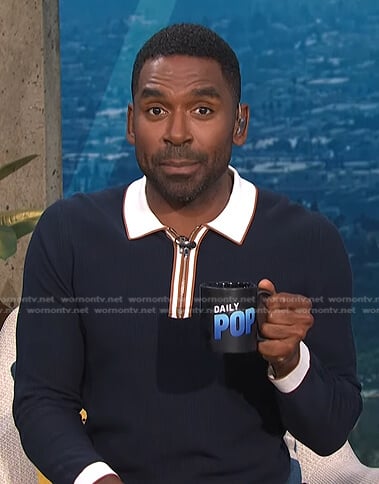 Justin's navy collared sweater on E! News Daily Pop