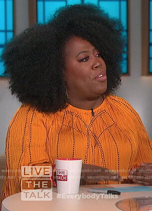 Sheryl's orange crickled blouse on The Talk