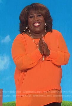 Sheryl's orange layered top on The Talk