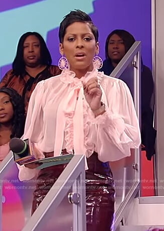 Tamron's pink ruffle sheer blouse on Tamron Hall Show