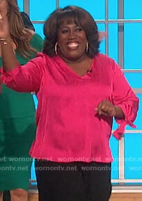 Sheryl's pink satin tie cuff top on The Talk